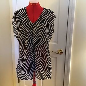 Women’s Sunny Leigh black and white dressy sleeveless top.